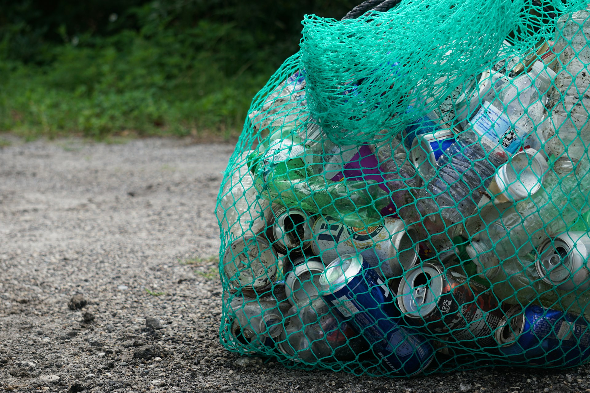 blue plastic bottle in green net